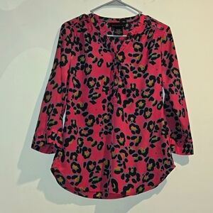 Attention black teal animal print top. Size small.